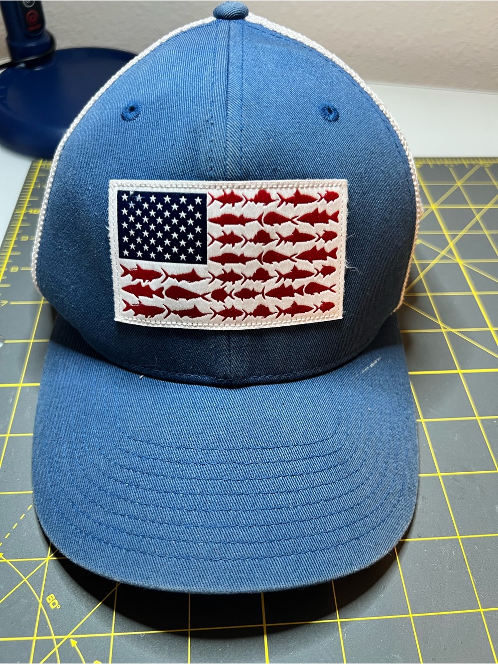 Columbia Blue Hat with Red Fish Flag Patch